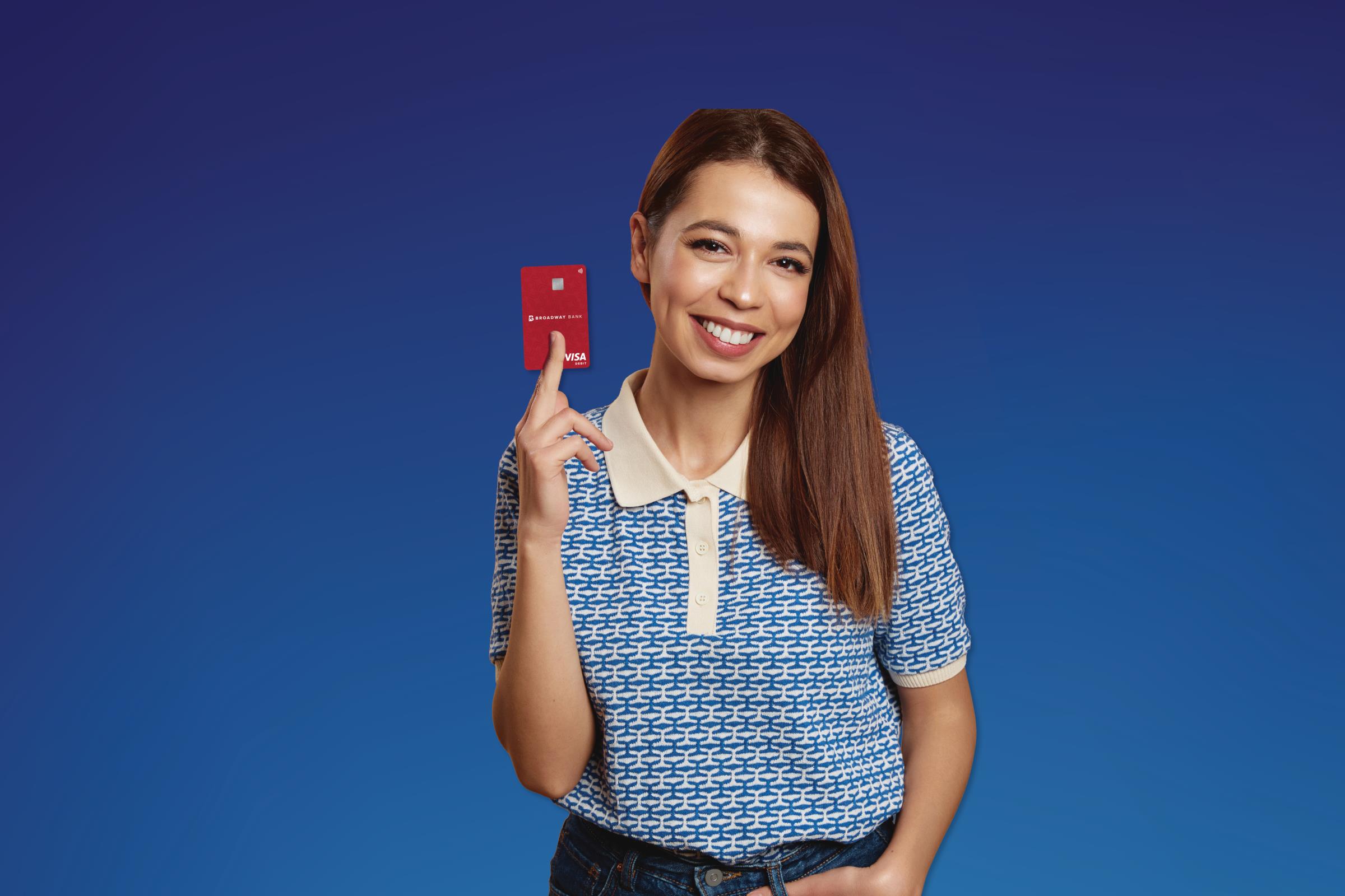 A young lady excited on a blue background - earn $300 when you open free checking