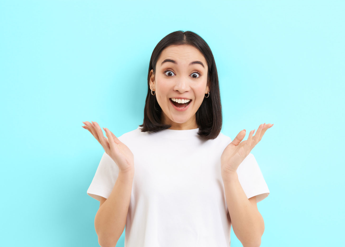 A young lady excited on a blue background - earn $300 when you open free checking