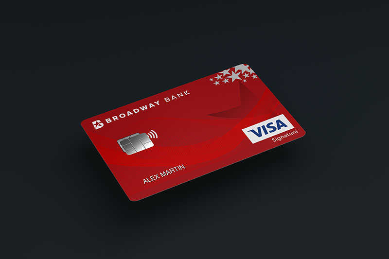 Red Broadway Bank Visa Signature Elite Card laying on a black background