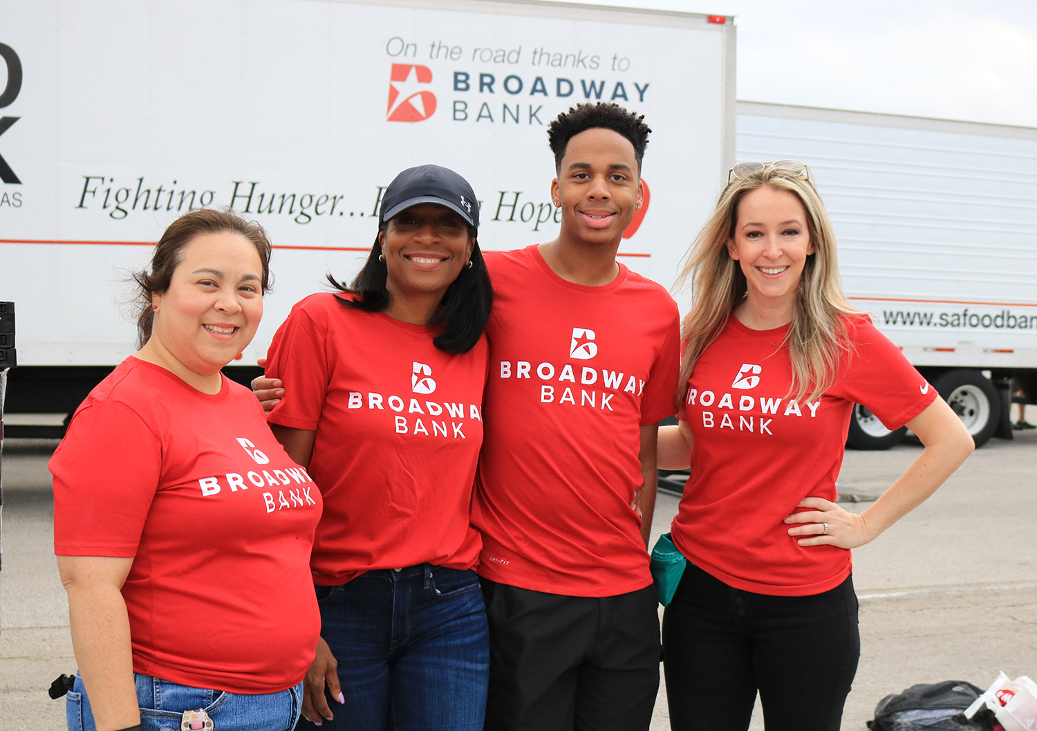Broadway Bank Employees give out food to help their local Texas community