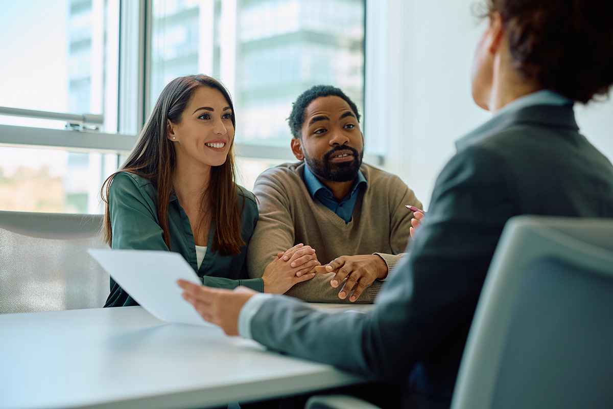 Couple talking to a banker