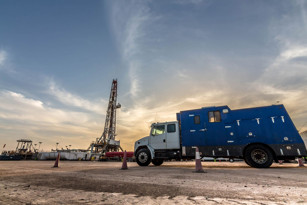a truck moves inventory on an oil field