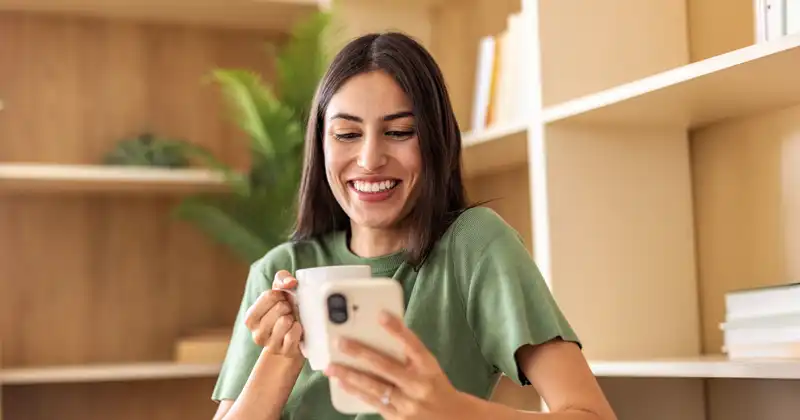A young woman looking at her phone