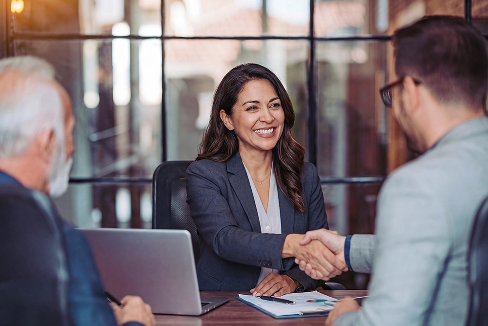 A wealth advisor speaking to clients
