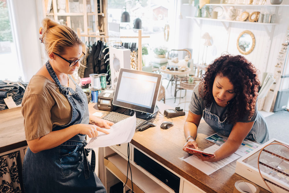 Small Business owners looking at paperwork