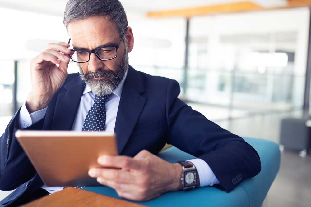a business professional reviews his investment loan options