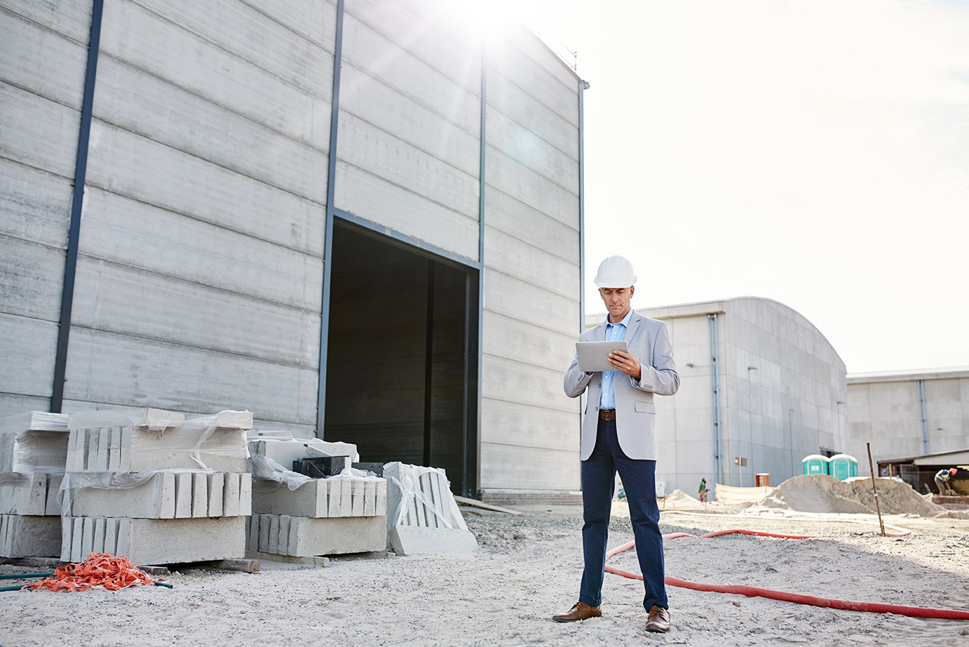 Man wearing construction hat at a construction site