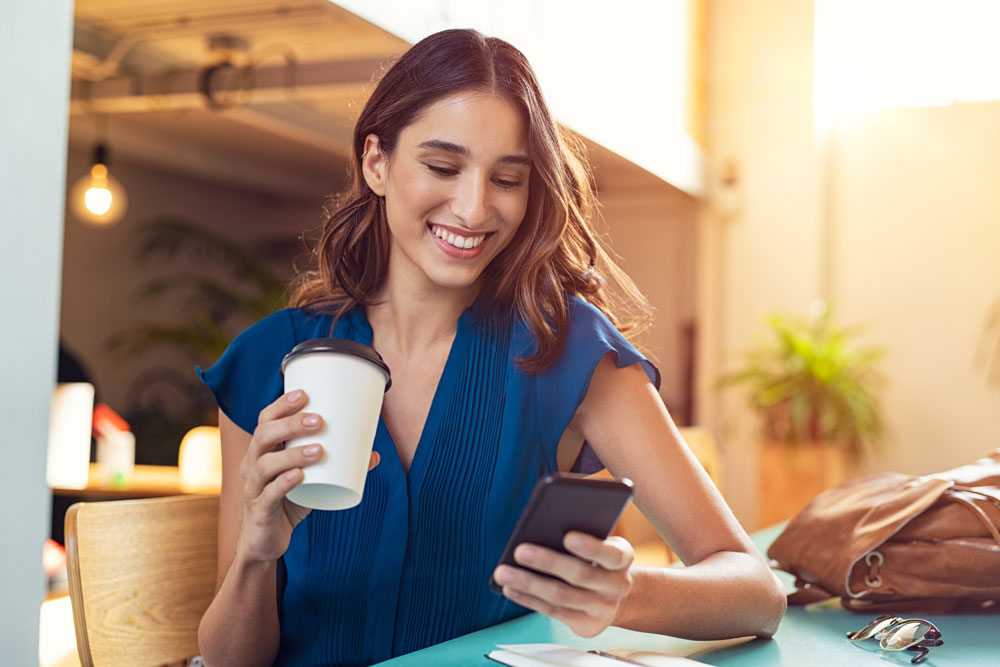 Young woman looking at her phone