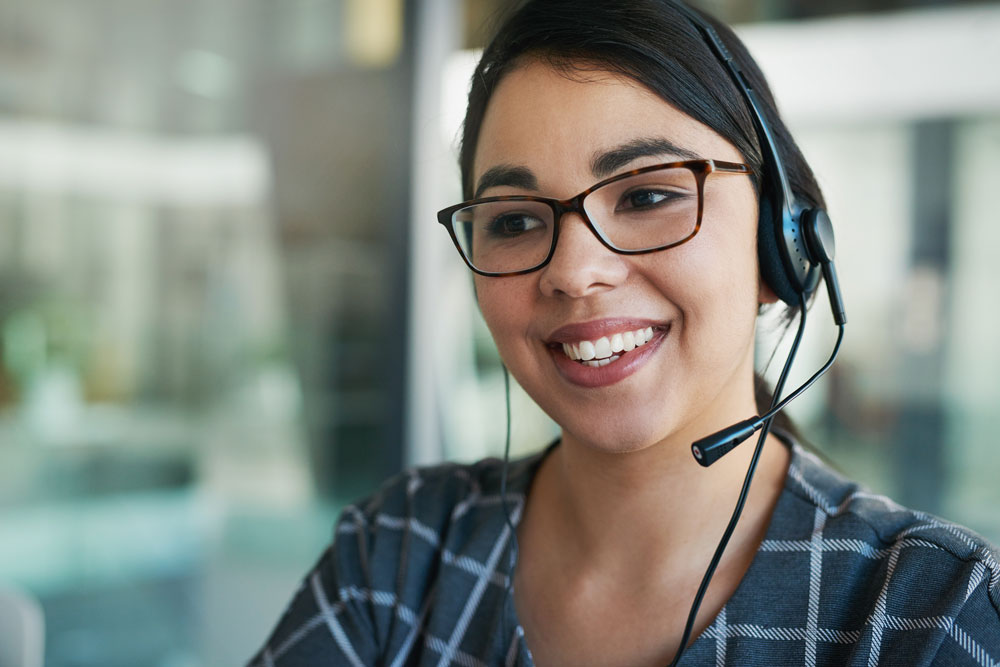 A lady answering a call at a call center