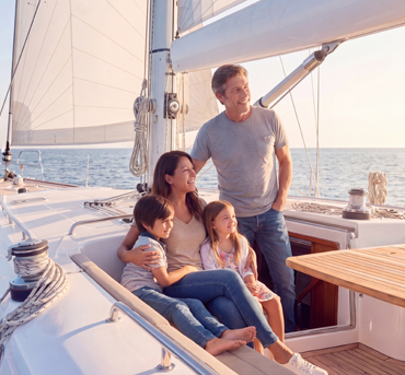 A couple sailing with their young children