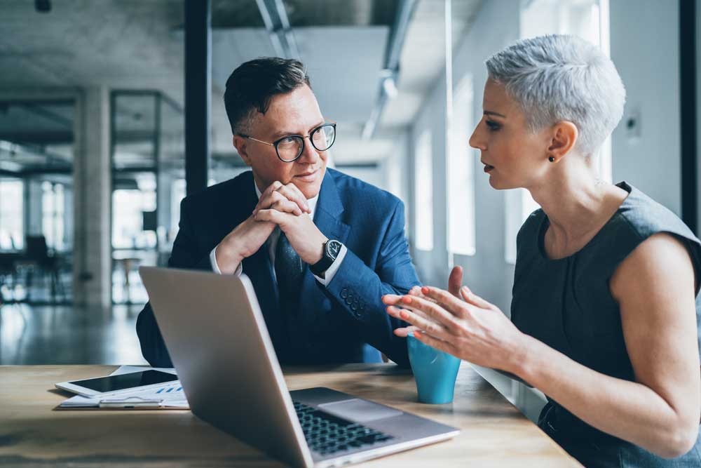 A man and business woman discussing about premium modern banking