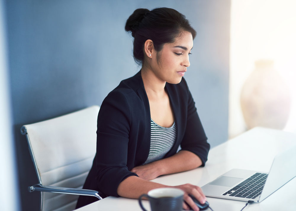 A woman working on her laptop
